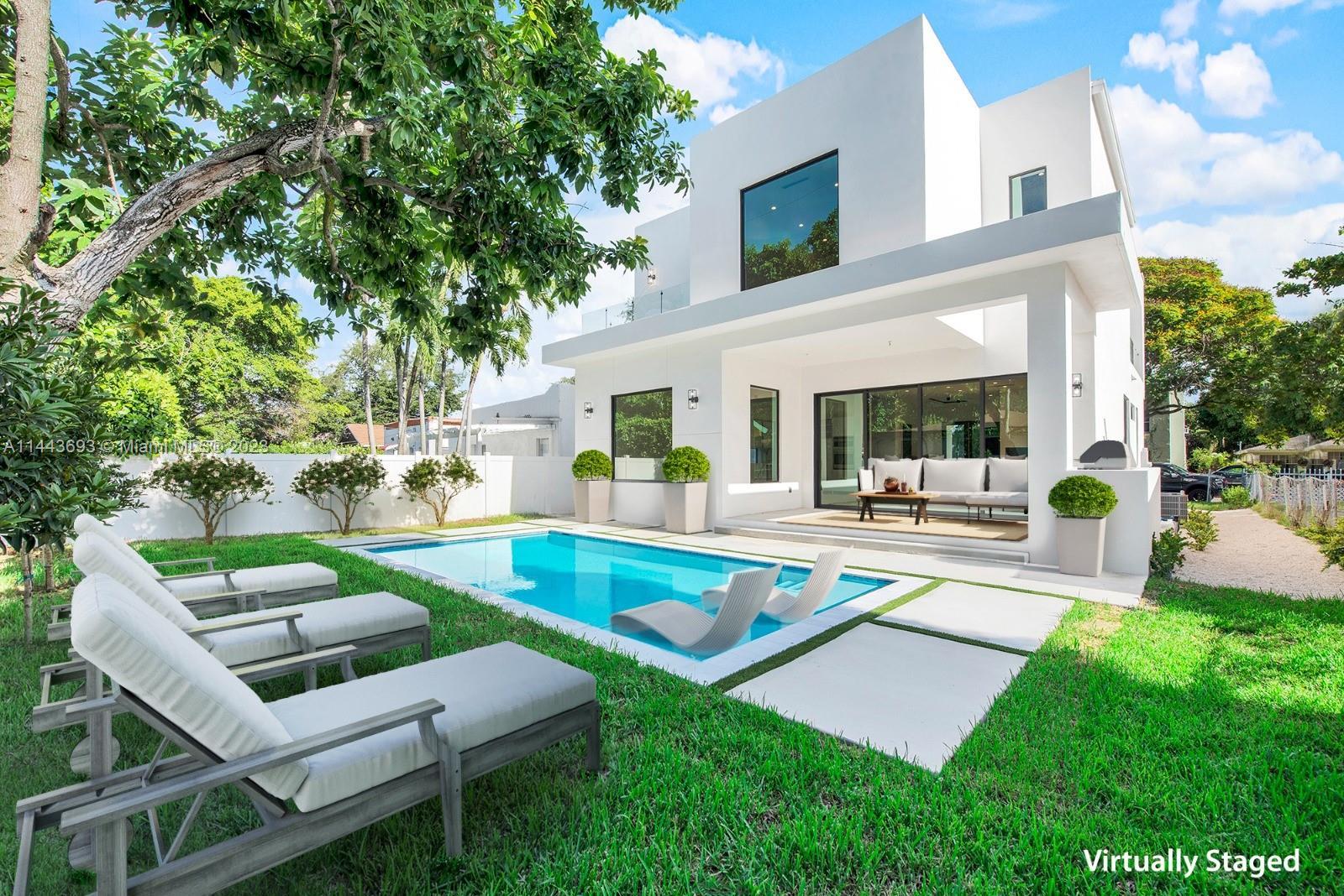 Sophisticated contemporary elegance located near the Design District, Midtown, and Miami Beach. This