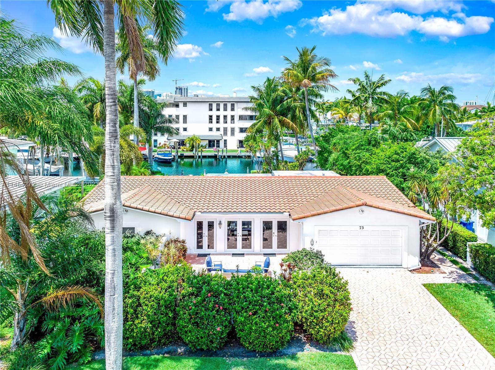 Waterfront mid-century ranch located within the luxurious Las Olas Isles. A widened street, higher e
