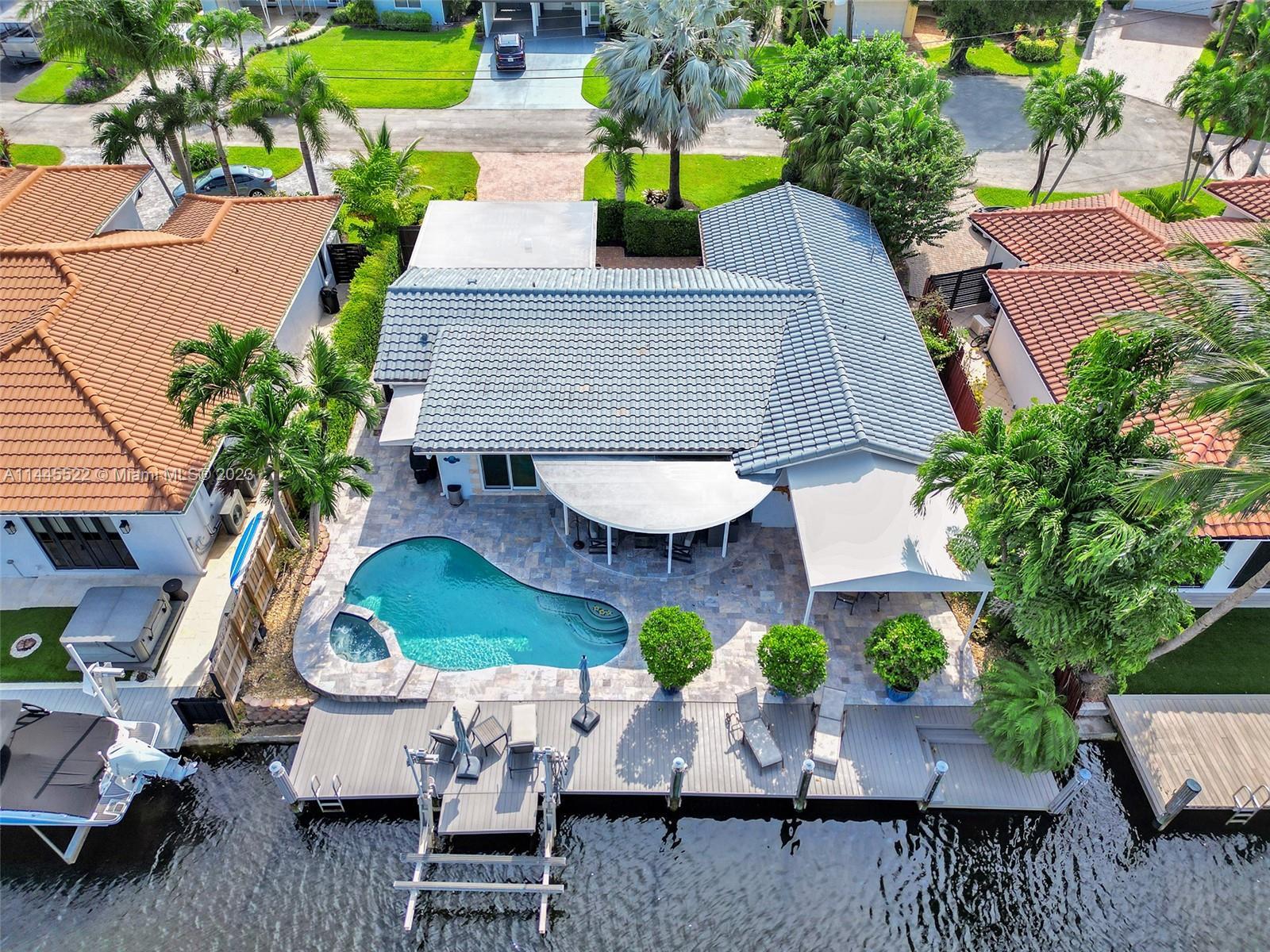 This OCEAN ACCESS waterfront pool home is located at the end of a PRIVATE CUL-DE-SAC in desirable Wi