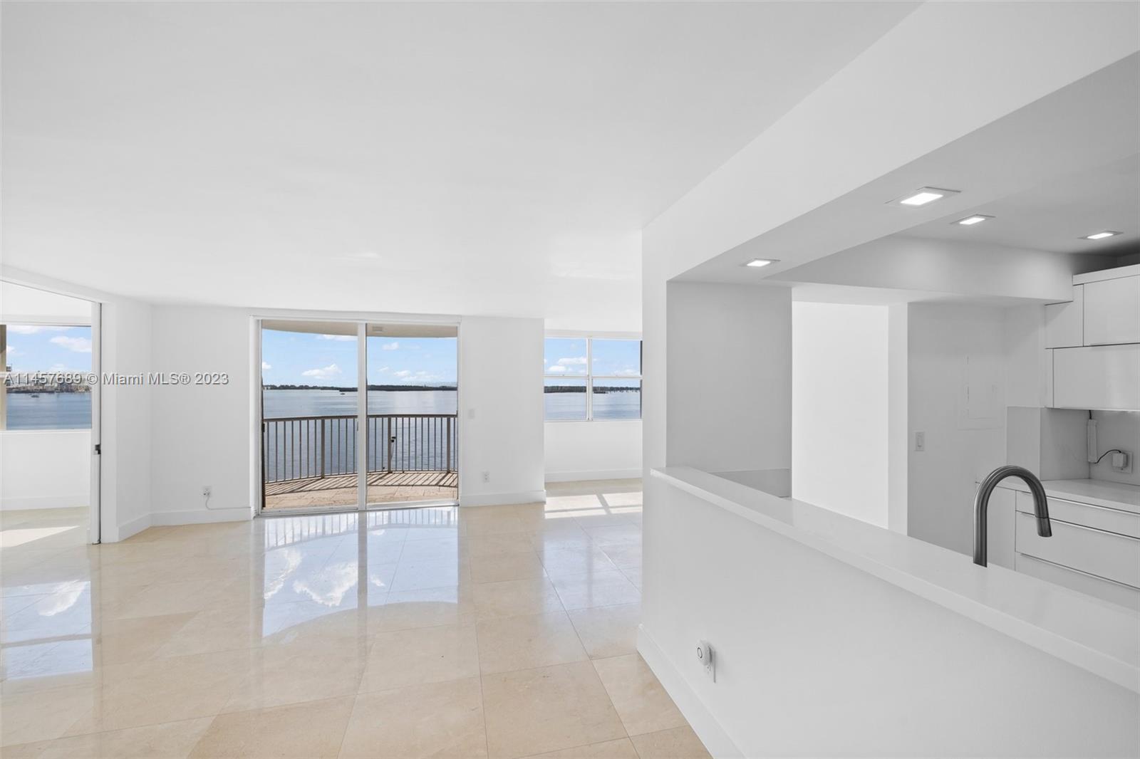 Captivating 3BR/2BA Corner Unit with Mesmerizing Biscayne Bay Views, gracing the 10th floor with awe