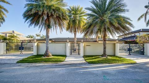 This amazing contemporary home built on 2 lots with large open design, allowing all glass doors to f