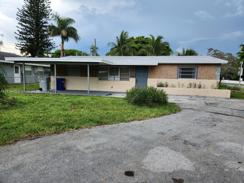 Great Location. This 3 bed/2 bath on a corner lot with huge parking space. attached carport. No HOA!