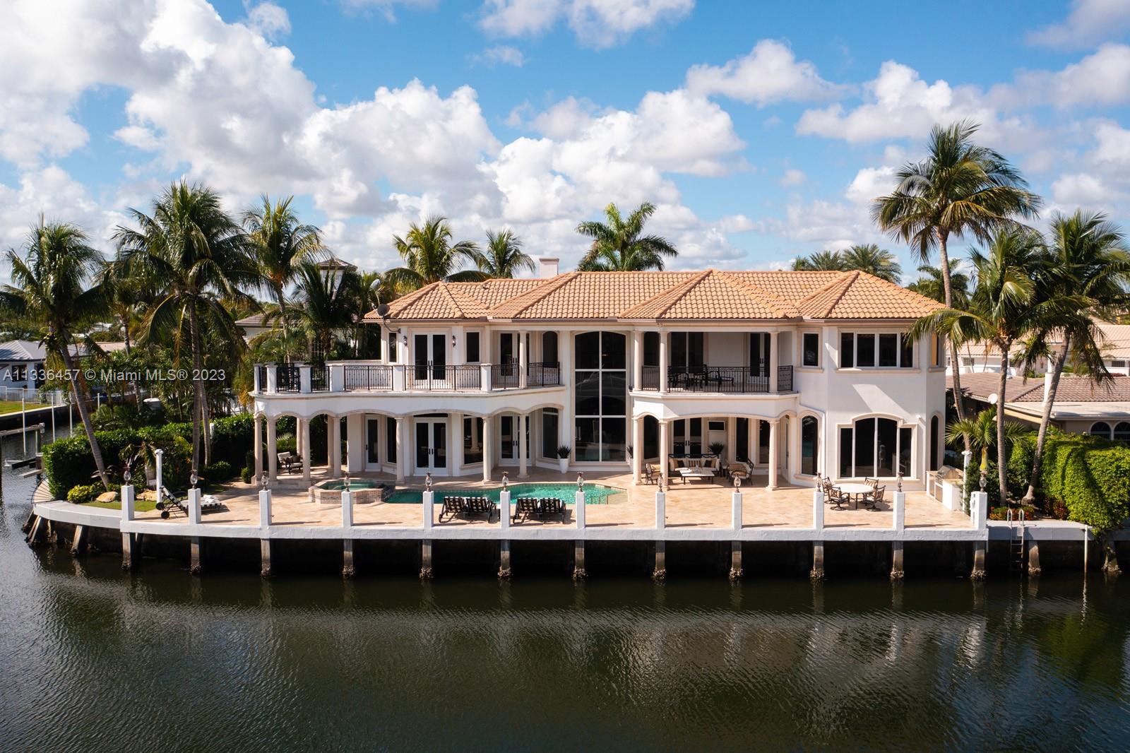 Breathtaking, one-of-a kind villa on a prime waterfront point-lot in prestigious & secluded Boca Bay