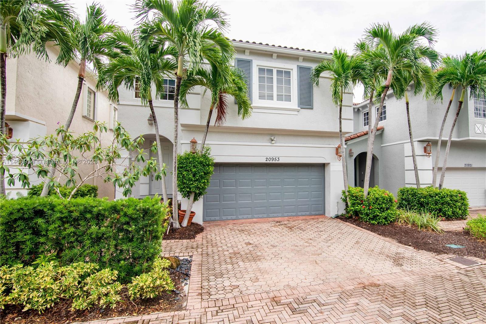 Welcome to this modern open concept home located in the prestigious Aventura Lakes Phase 1.This beau