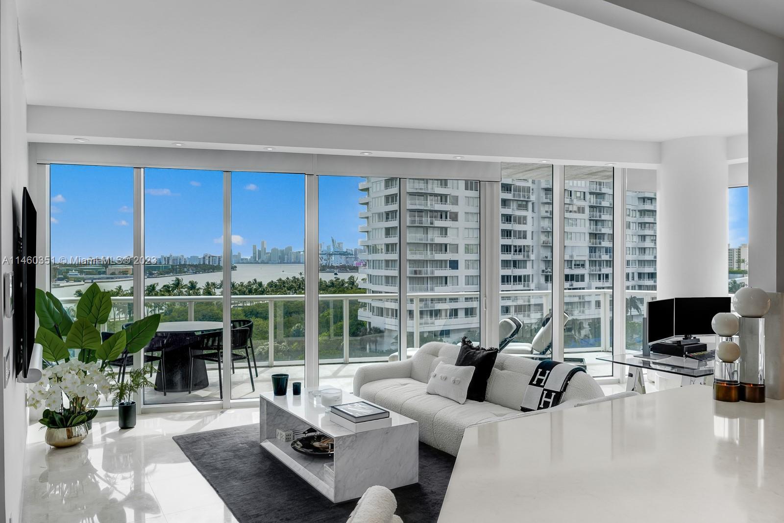 Enjoy unobstructed sunsets in this rare corner luxury residence.  Take in views of Fisher Island, Go