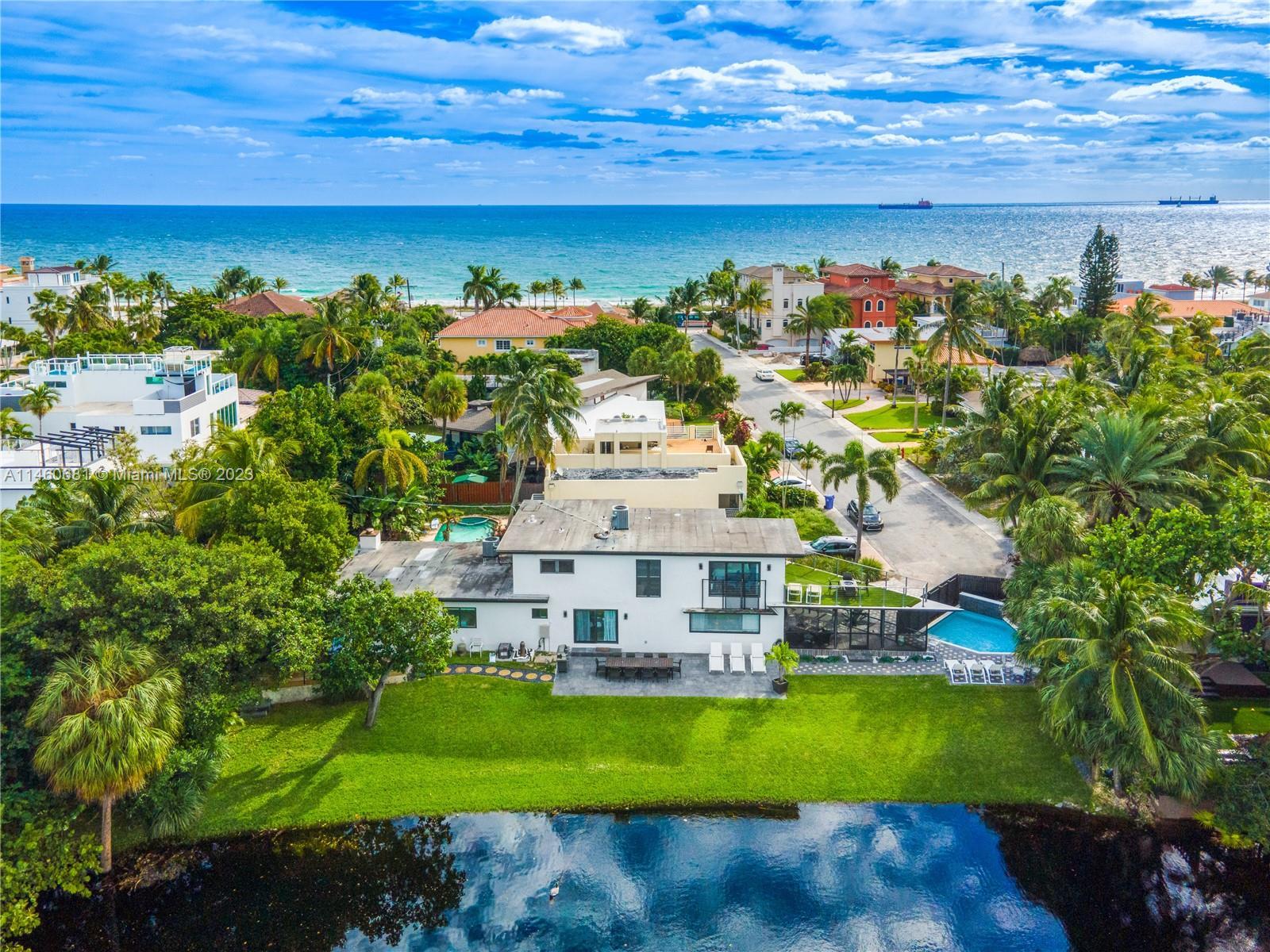 NESTLED IN THE HEART OF PARADISE, this exquisite two-story home offers an unrivaled coastal living e