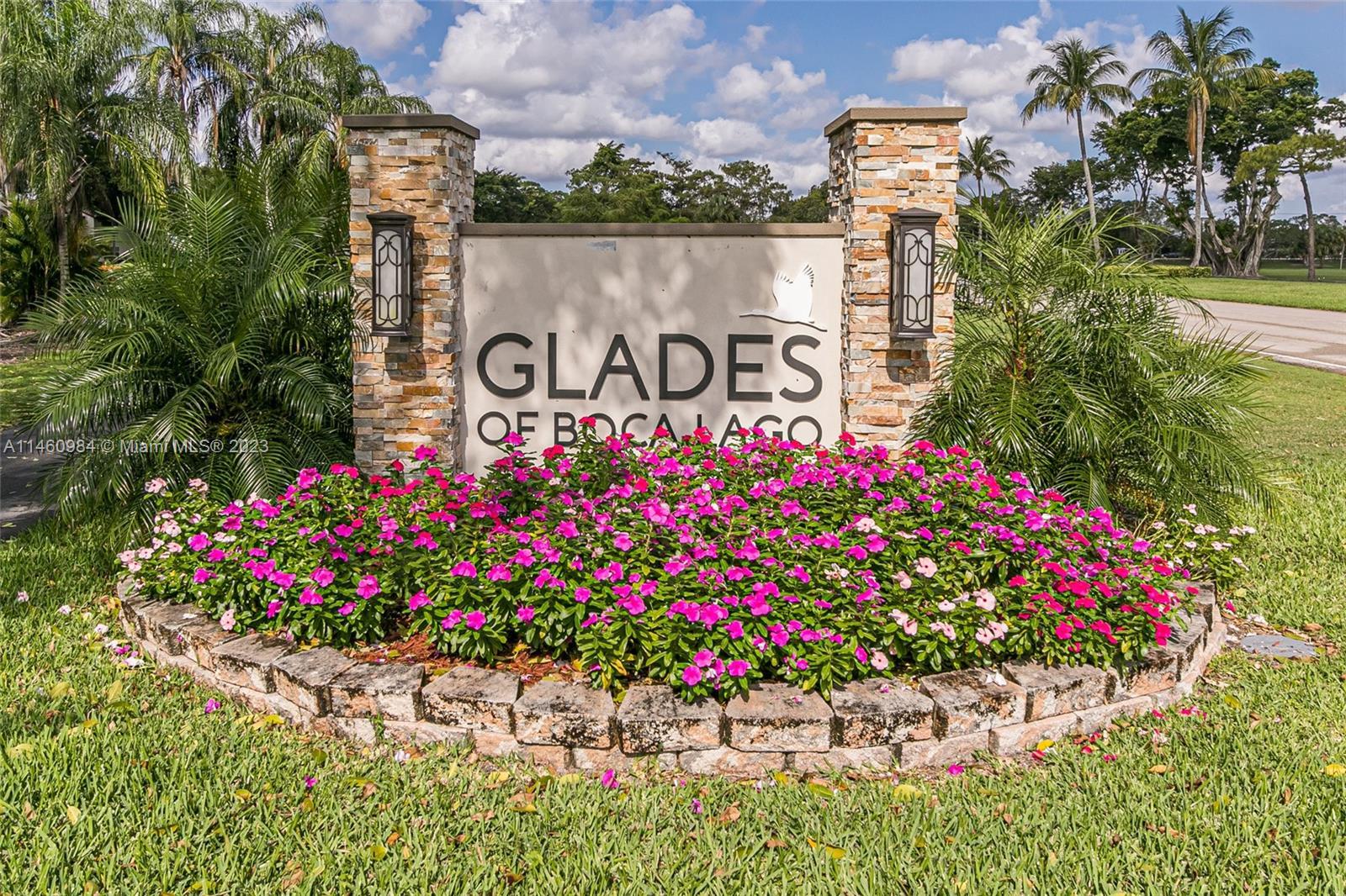 Stunning Golf views!  First floor condo corner unit 2/2 in best location in Boca Lago. Glass enclose