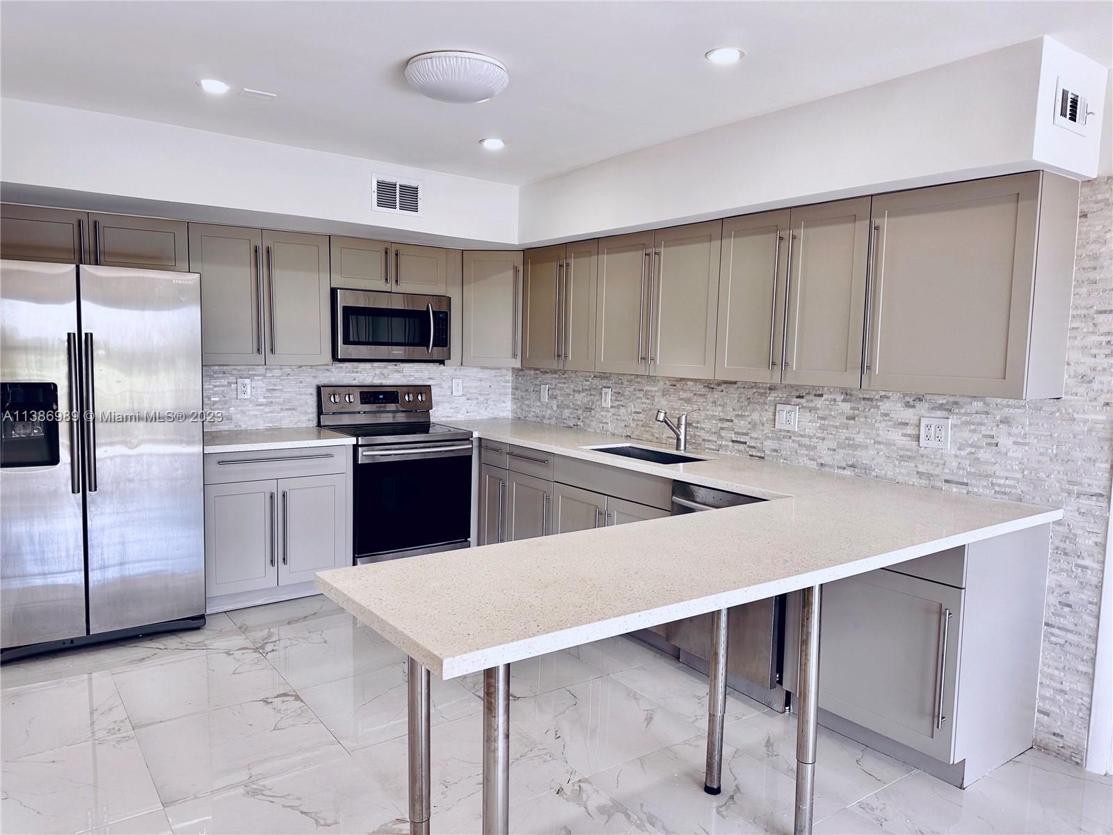 Remodeled, spacious unit directly on the water, across the diplomat golf course, walking distance to