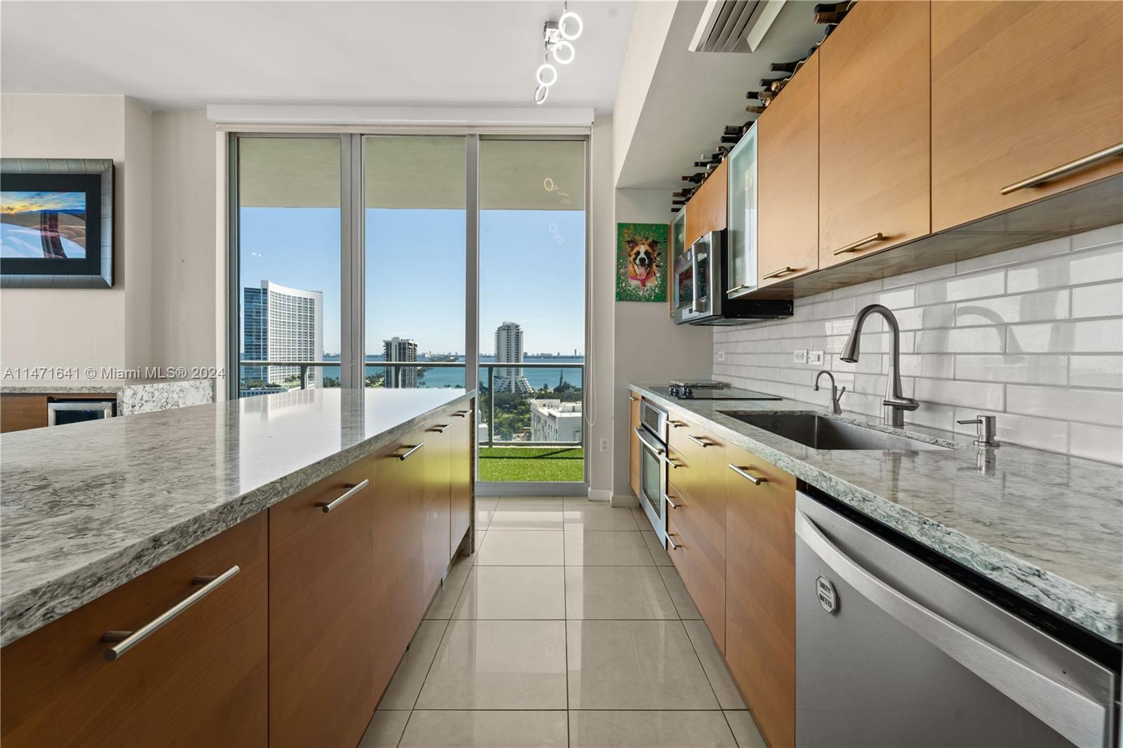 Overlooking the Miami Design District and Biscayne Bay from the 16th floor, discover your next home 