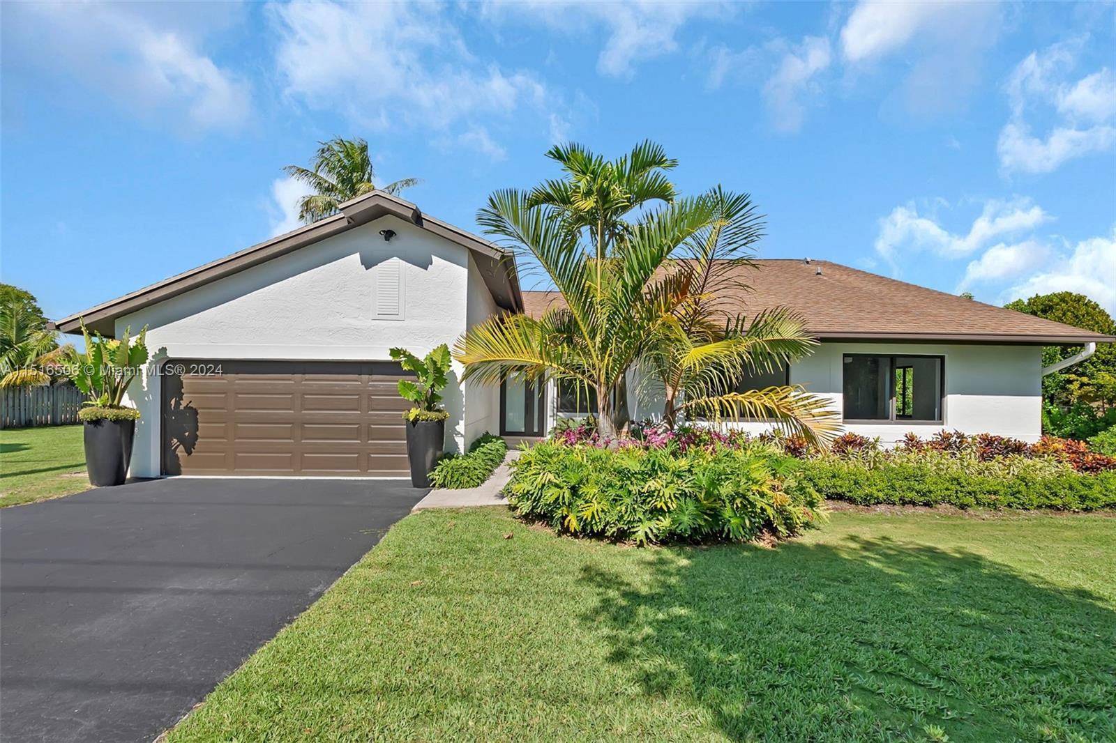 This stunning, completely remodeled home boasts 4 spacious bdrms & 2.5 baths on an oversized, gated 