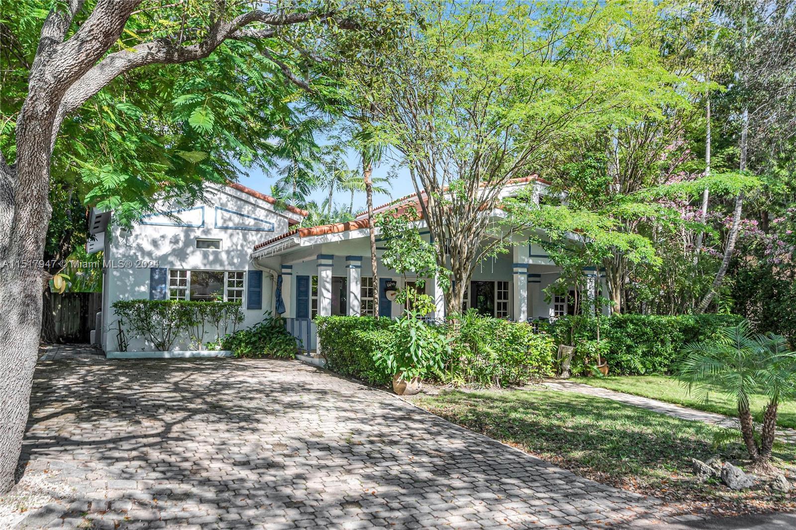 The "Key" to your piece of paradise awaits you! This charming coastal beauty sits on a picturesque t