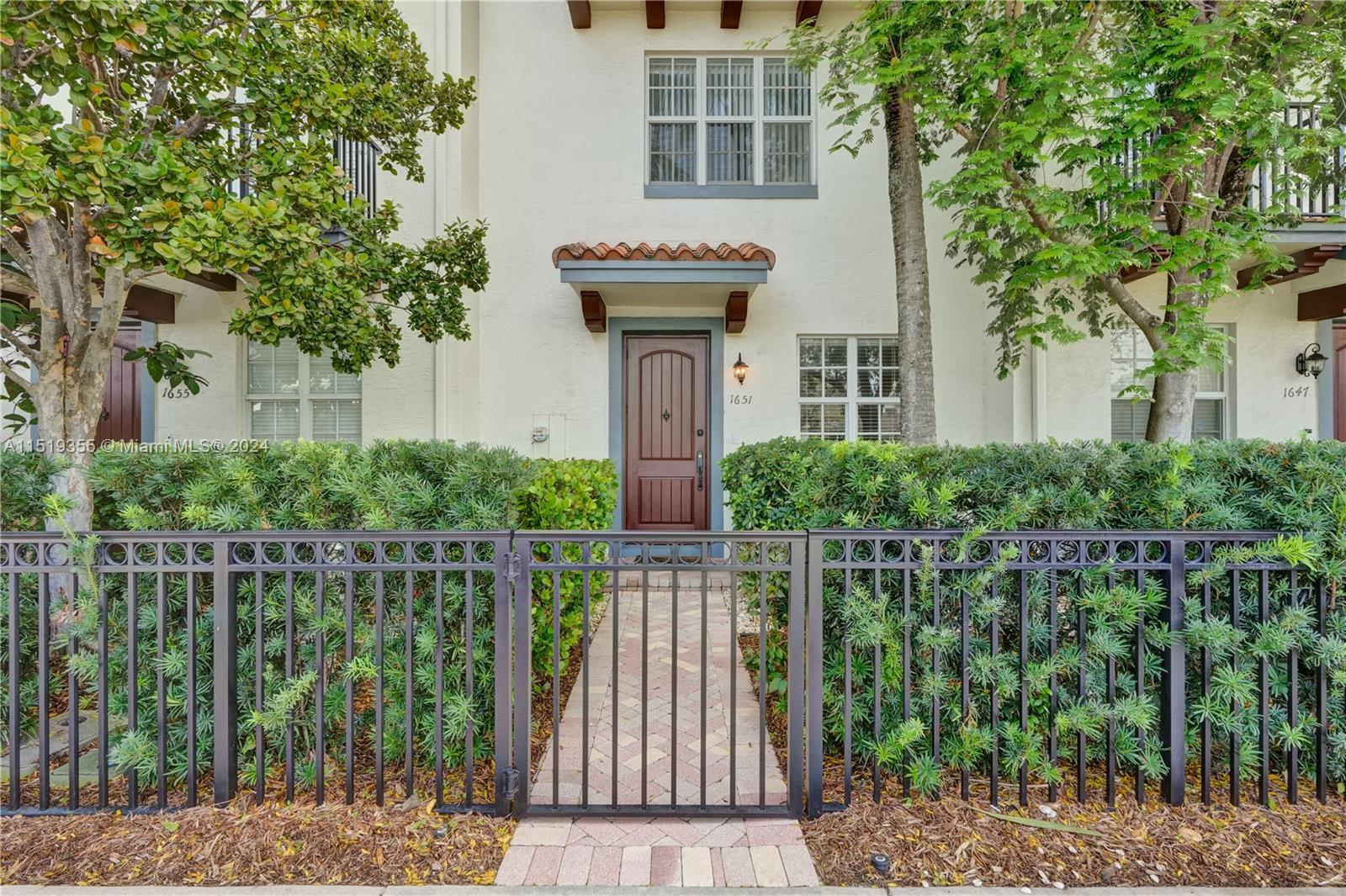 Nestled within the vibrant heart of Delray Beach, this exquisite three-story townhome offers both lu