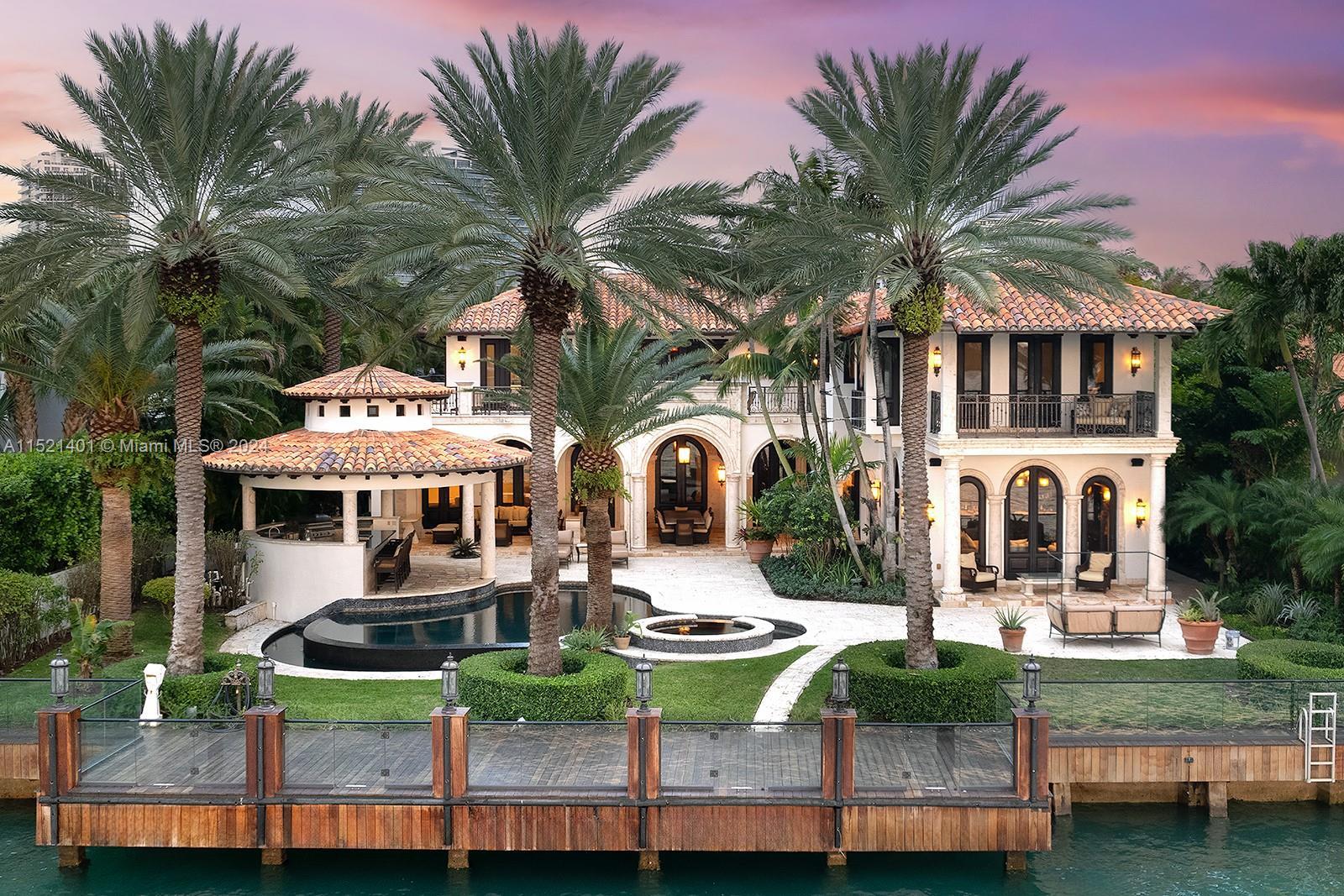 Welcome to this timeless Mediterranean waterfront estate in the exclusive guard-gated neighborhood o