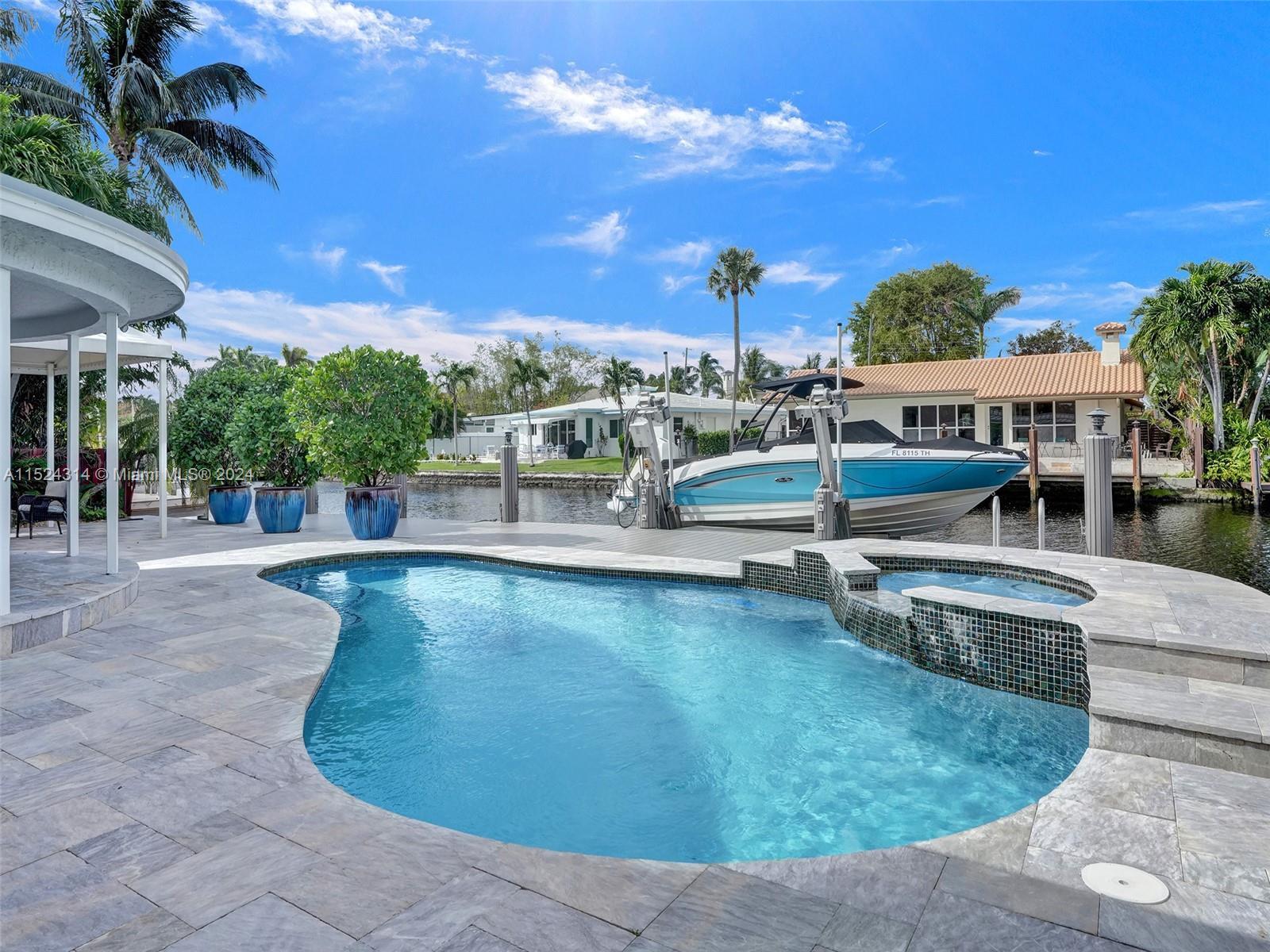Embrace waterfront serenity in this stunning pool home nestled at the end of a private cul-de-sac in