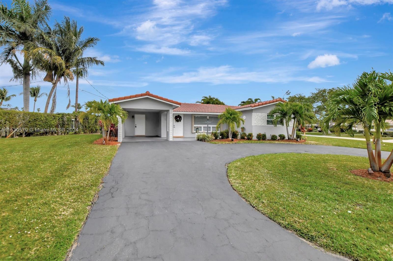 Renovated home in the prestigious and sought after community of Boca Islands. Literally surrounded b