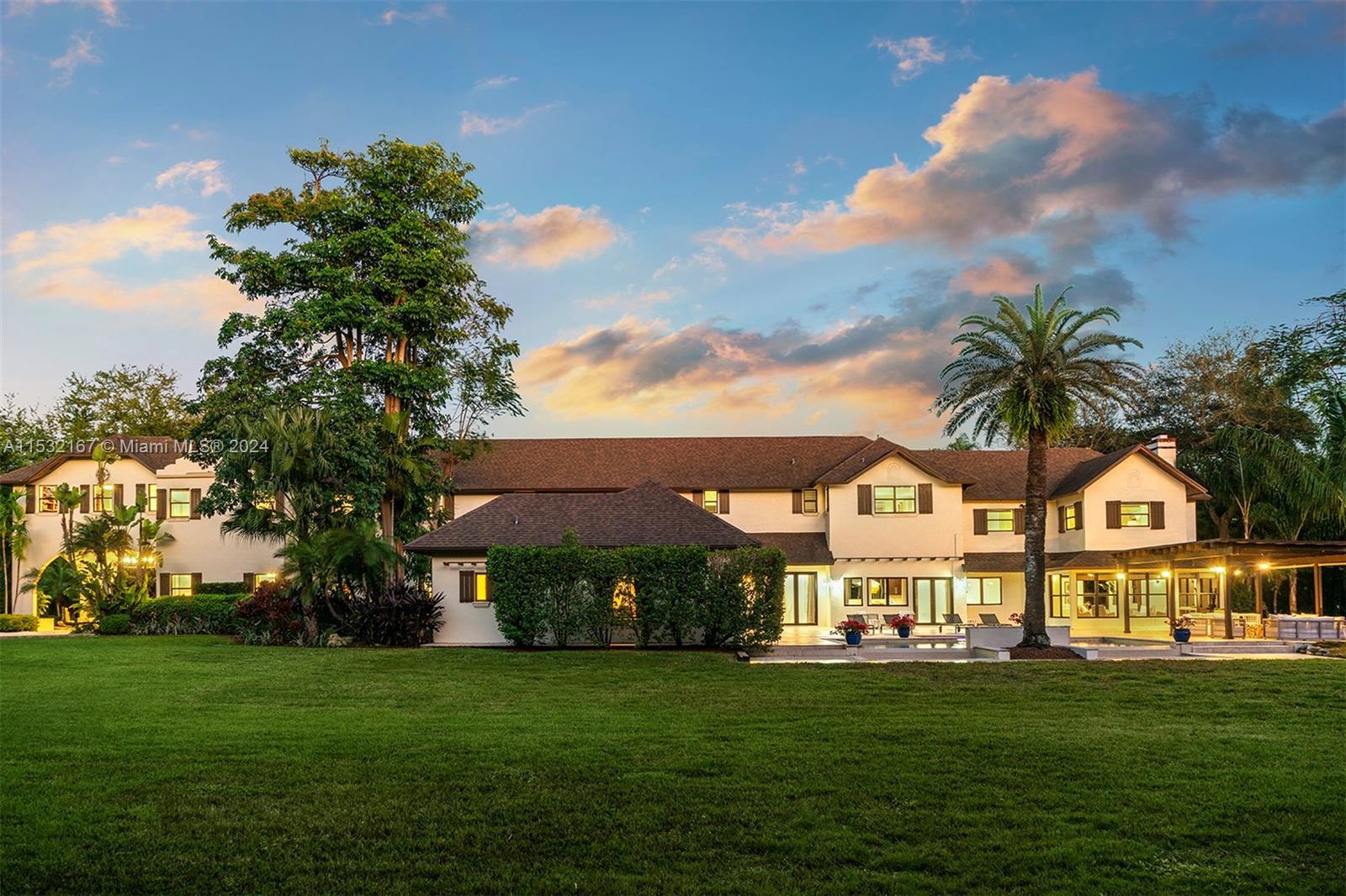 Nestled in Pinecrest, this traditional charm w modern updates estate graces a stunning 1.5-acre gate