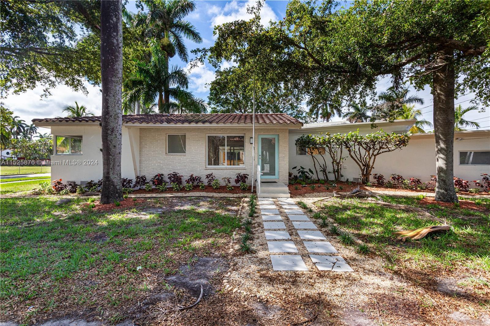 Discover the charm of Hollywood Lakes with this 3-bed, 2.5-bath home, minutes from pristine beaches,