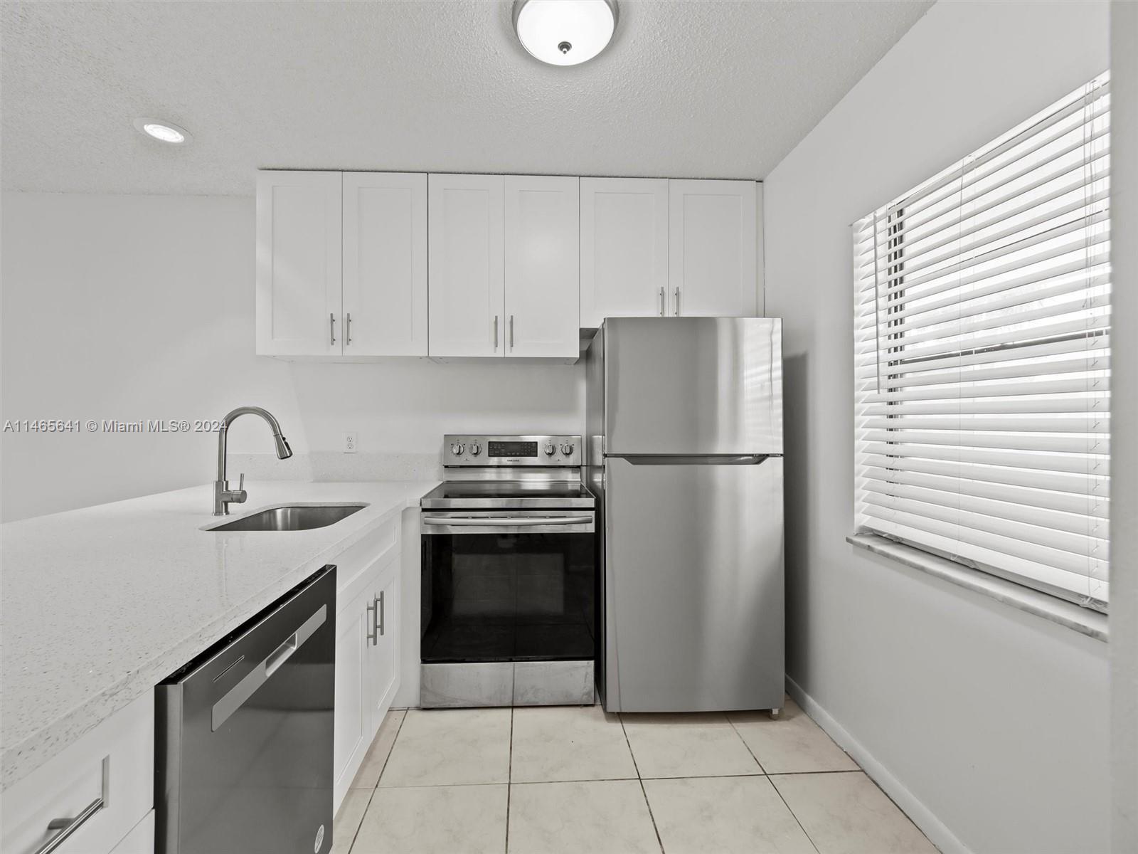 All ages condo - Move-in ready 2/2 in Boca. This condo features an updated open Kitchen with quartz 
