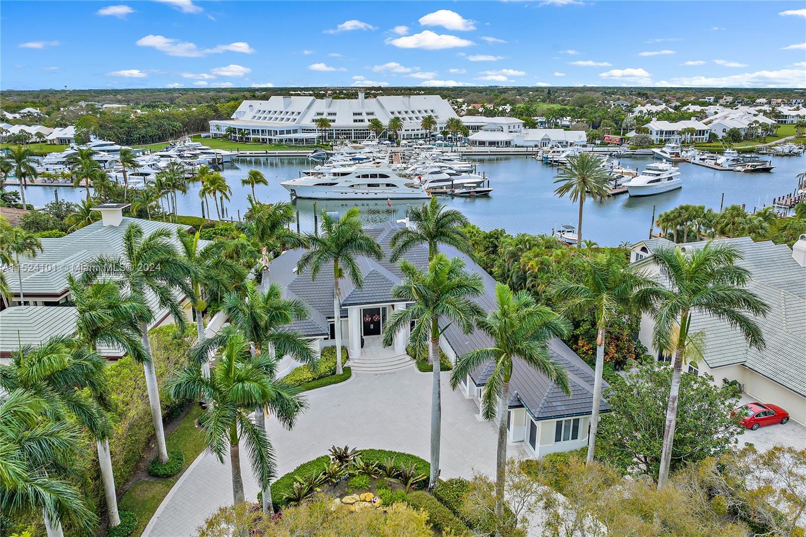 Spectacular Admirals Cove Estate Home on the Spyglass Lane cul-de-sac has a captivating view of the 