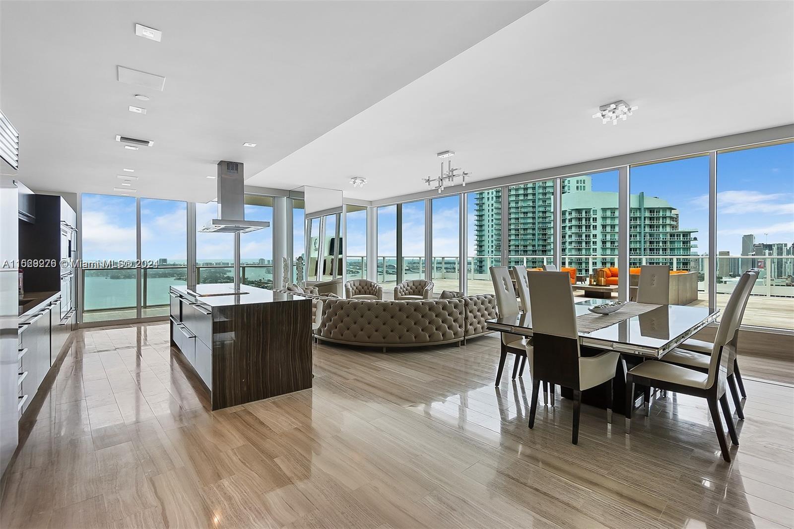 An absolute one of a kind designer Penthouse perched over Biscayne bay with sweeping 270 degree view