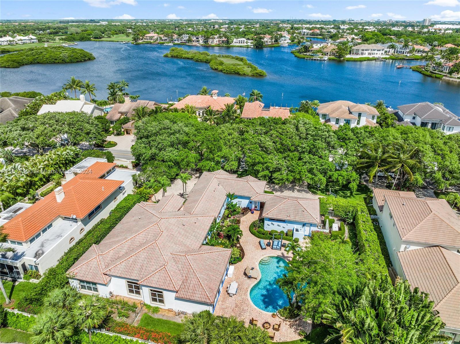 DOUBLE LOT - Situated in the prestigious Admirals Cove, this property stands as a rare gem, encompas