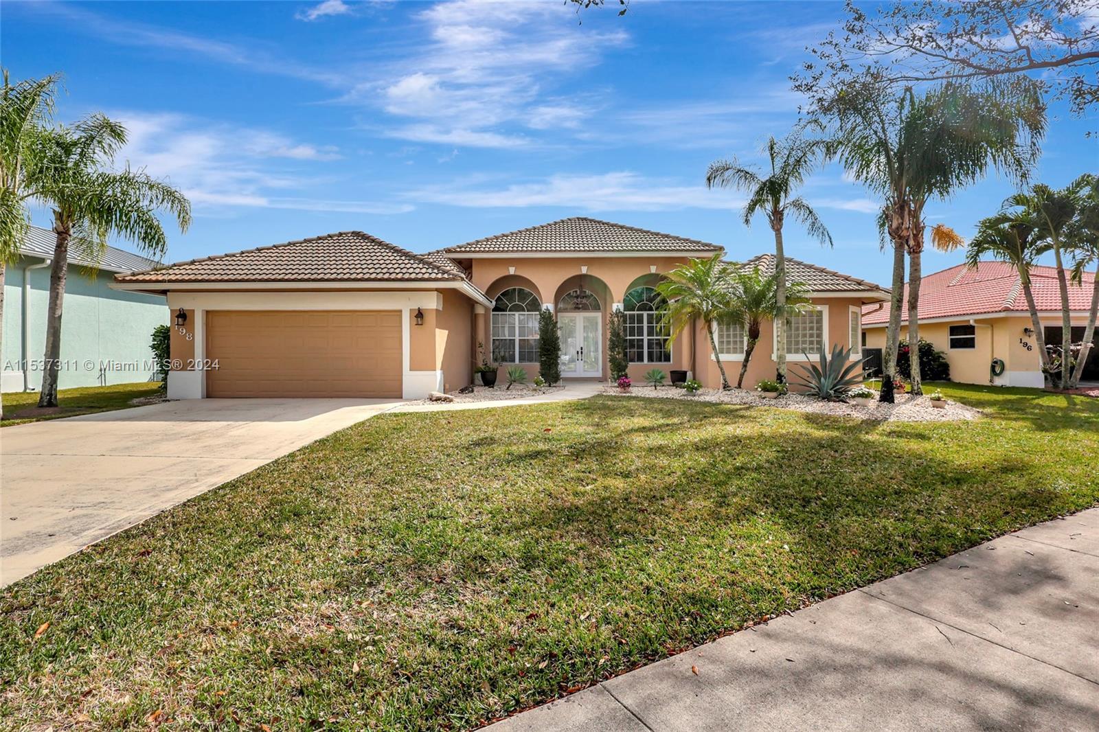 Welcome to the Estates of Royal Palm Beach!  This beautiful 4/3 pool home has an additional room per