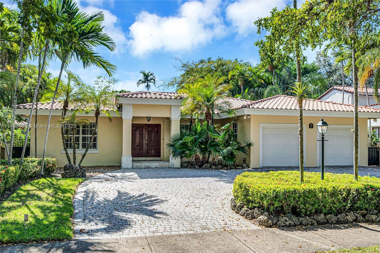 Designed for both beauty and functionality this 1998 Coral Gables home nestled on a premier street h