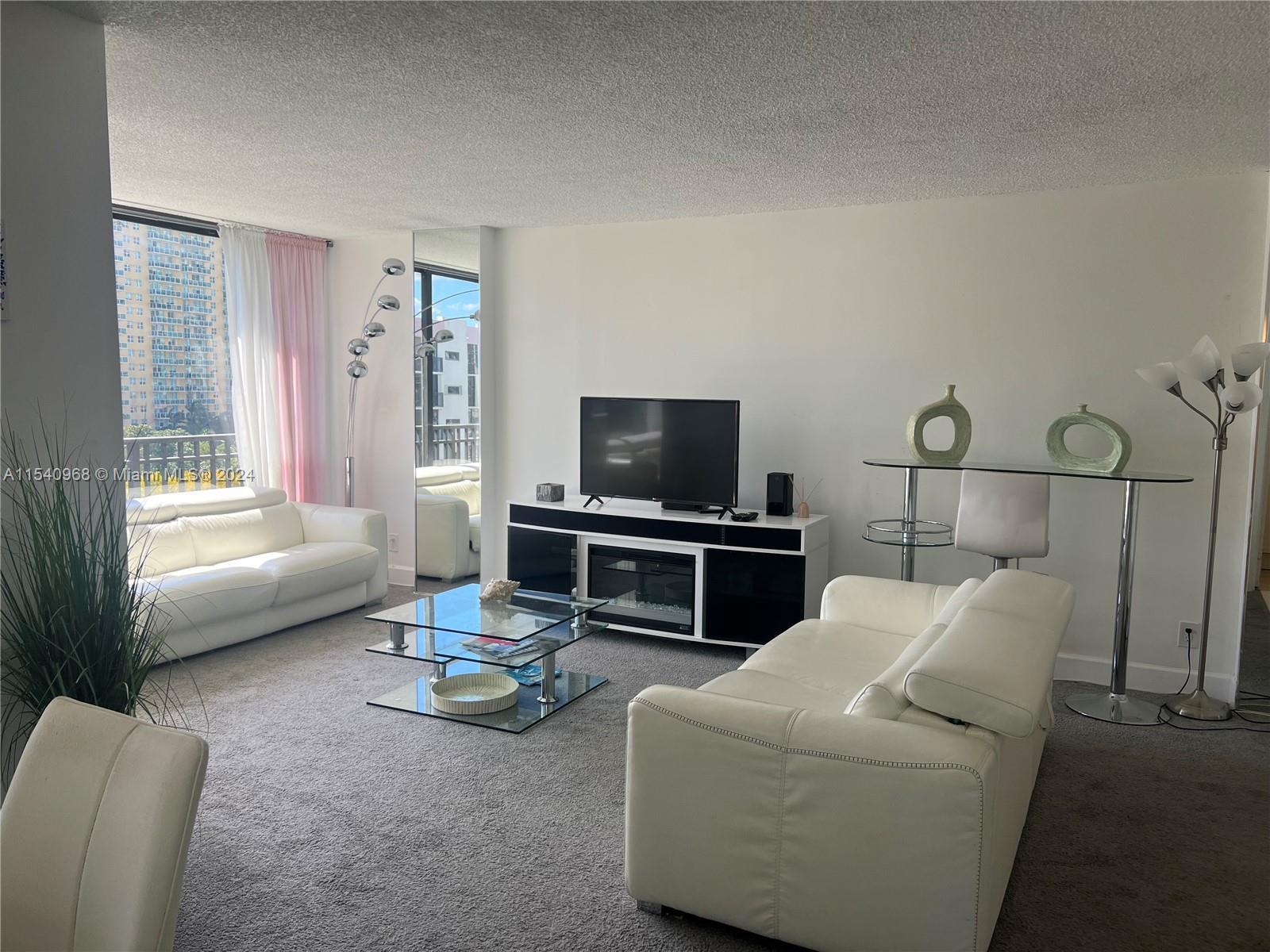 Cozy 1 bed 1 1/2 baths fully furnished for sale in the heart of Sunny Isles beach. Great garden view