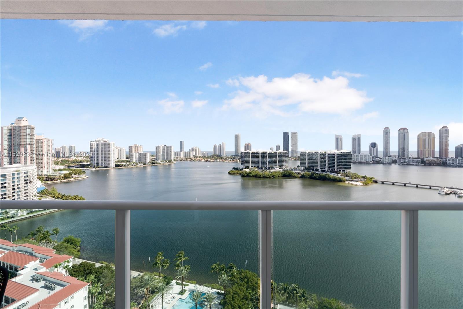 Spectacular bay and ocean views from this expansive unit at Peninsula II. This 3,464 Sq Ft flow-thro