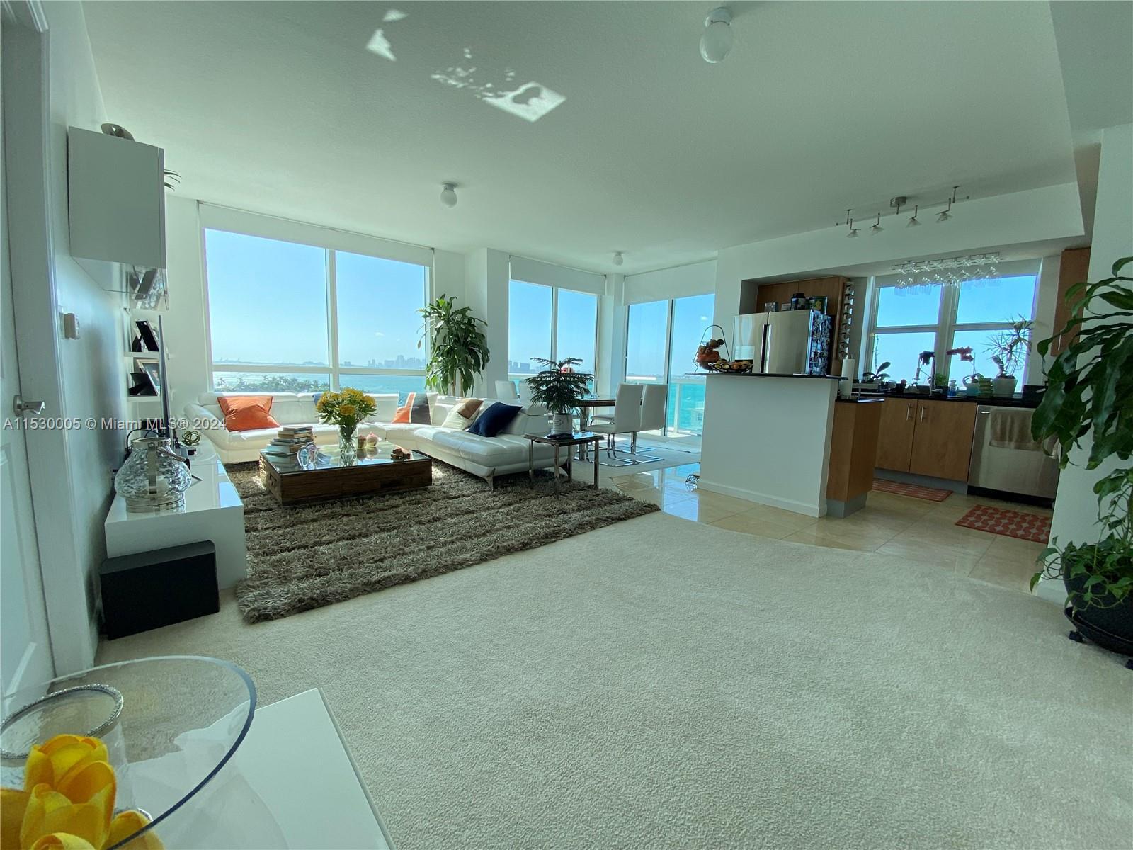 Coastal living in this 2-bedroom condo with a large enclosed Den, 2 bathrooms, and breathtaking view