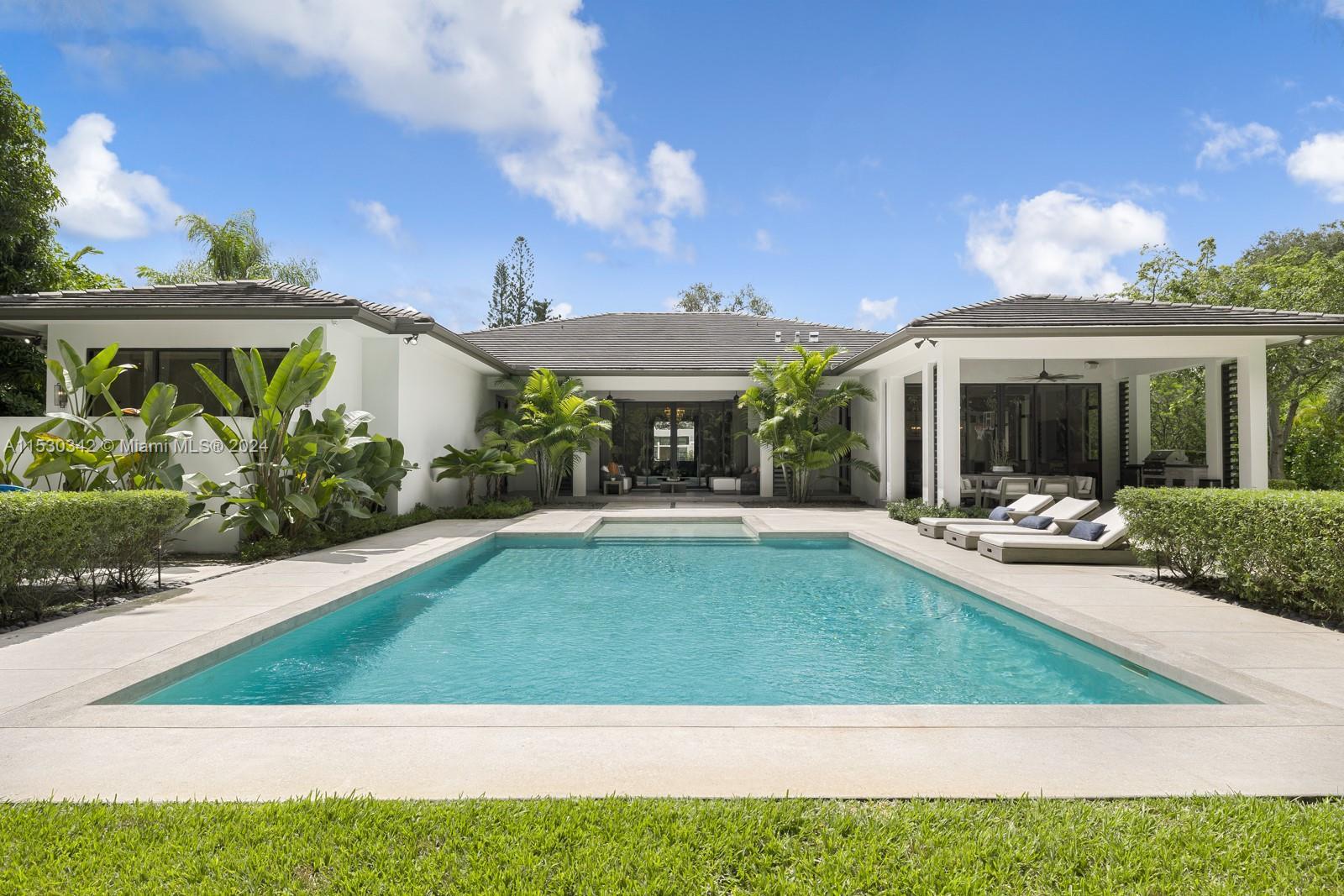 Luxury awaits in this Pinecrest modern estate, custom-built in 2020 with state-of-the-art constructi