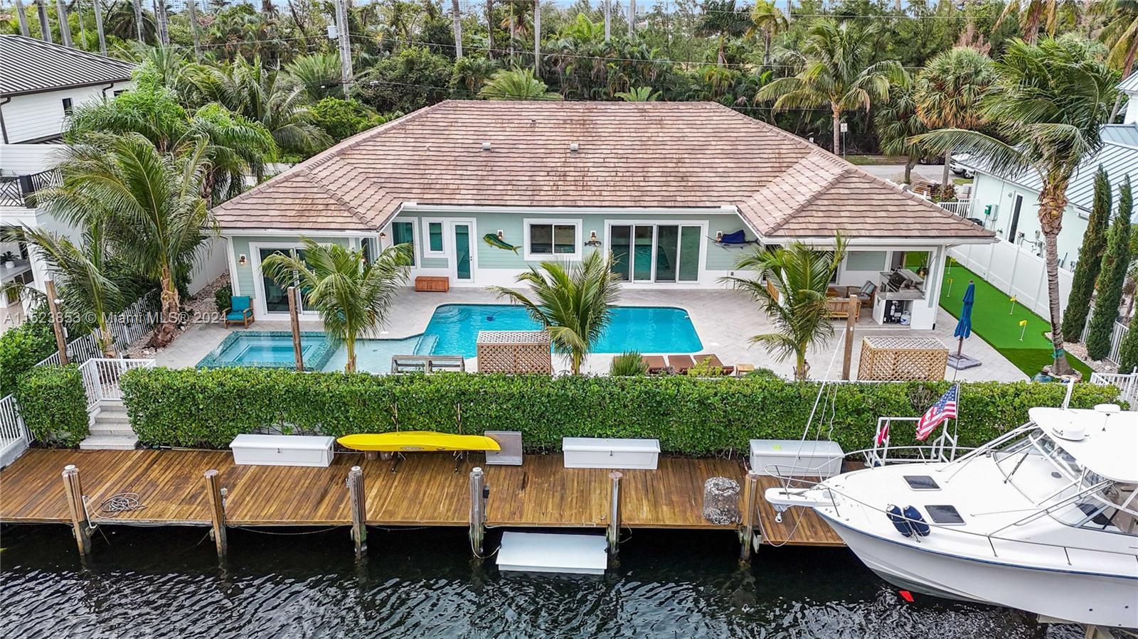 Indulge in the epitome of waterfront luxury living. Boasting a rare 100ft of pristine waterfront, a 