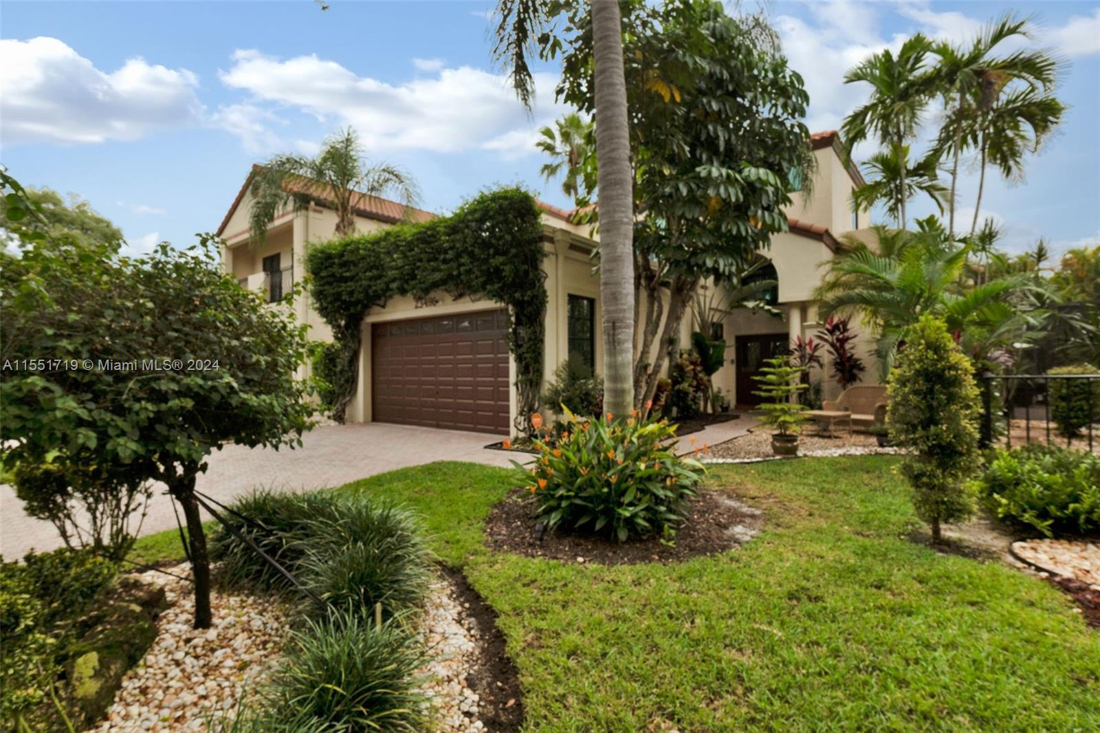 MAGAZINE-WORTHY AND STUNNINGLY RENOVATED TWO-STORY HOME IN PRESTIGIOUS VALENCIA, BOCA POINT GATED CO