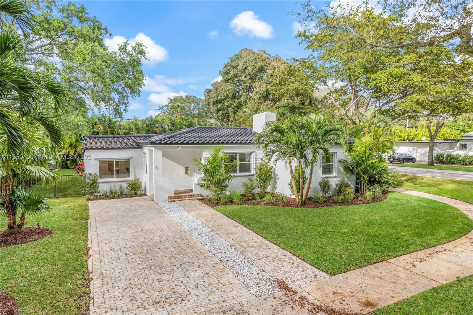 Beautiful, updated home in Miami Shores on a corner lot. The home features new engineered wood floor