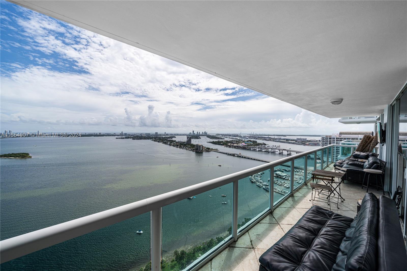 Enjoy amazing panoramic views of Biscayne Bay from this gorgeous apartment in the sky! This 2 bedroo
