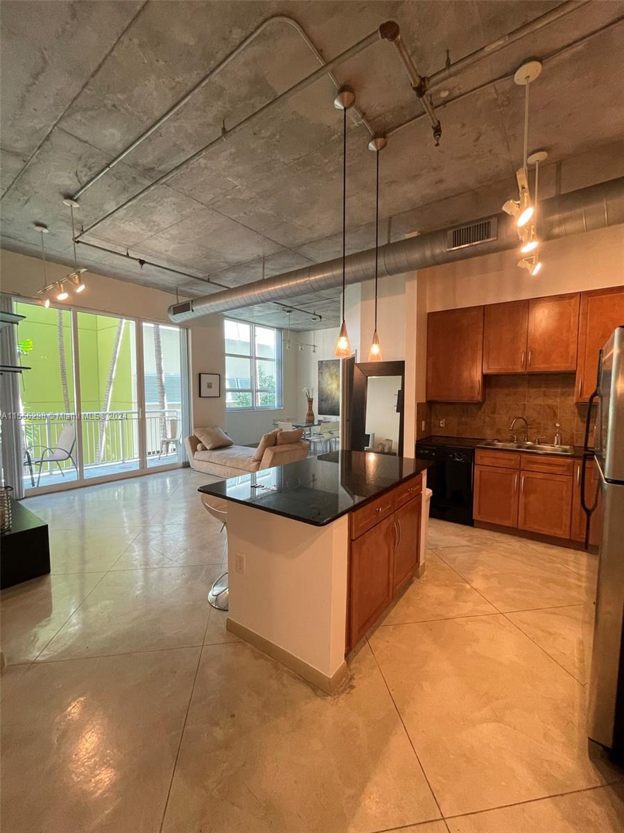 Experience the epitome of urban sophistication in the heart of East Edgewater. This loft-style resid