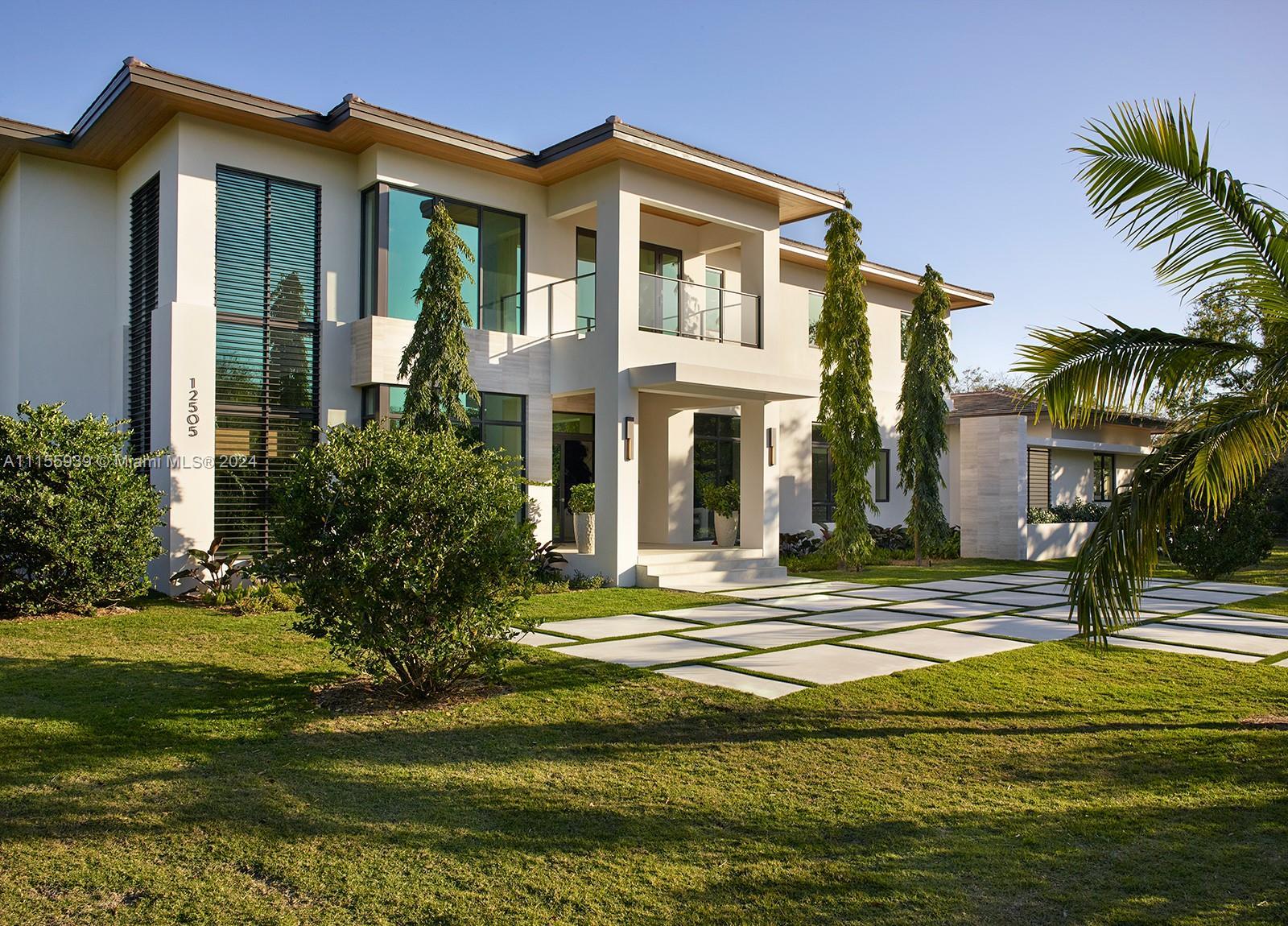 Turnkey Florida modern new construction by award winning Hollub Homes, on an idyllic Pinecrest stree
