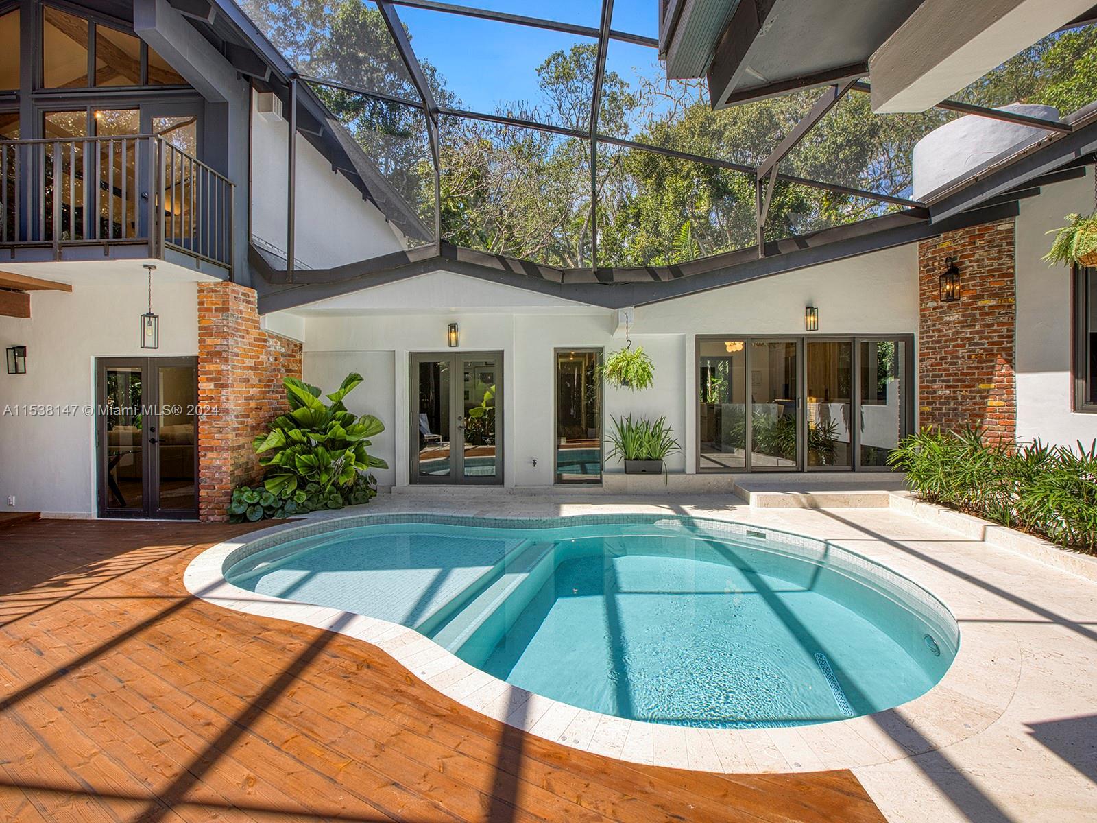 Contemporary haven within the exclusive enclave of Devonwood Pinecrest, this turnkey 5-bedroom 4-bat