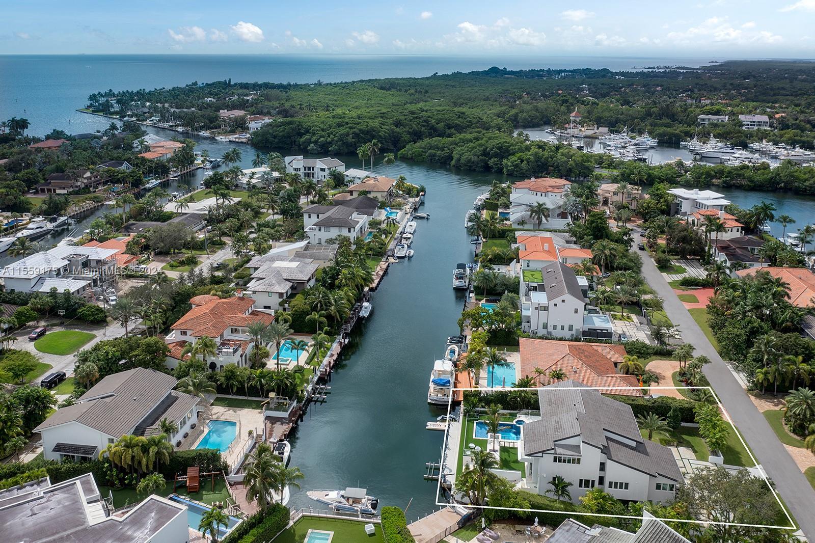 Nestled within the prestigious gated community of Sunrise Harbor in Coral Gables, this luxurious wat