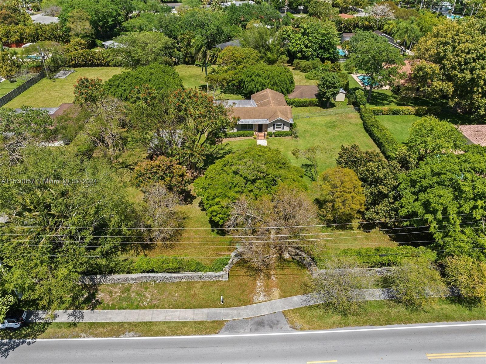 Pinecrest Investment Opportunity: This very nicely maintained 1939 ranch house rests in the center o