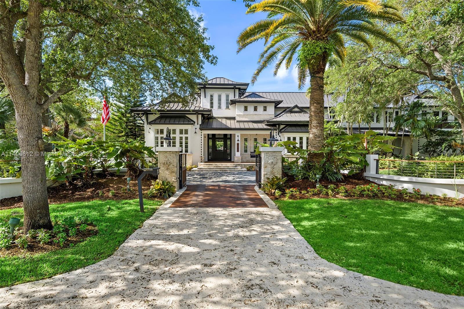 Welcome to Pinecrest's most exquisite custom-built masterpiece! This stunning estate is situated on 