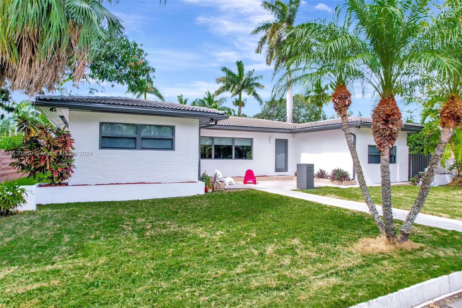 Welcome to this stunning mid-century home, nestled in desirable Miami Shores golf club community, si