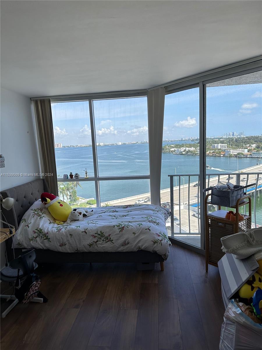 Wide bay views and balconies from both bedrooms and living room! Excellent location, minutes to the 