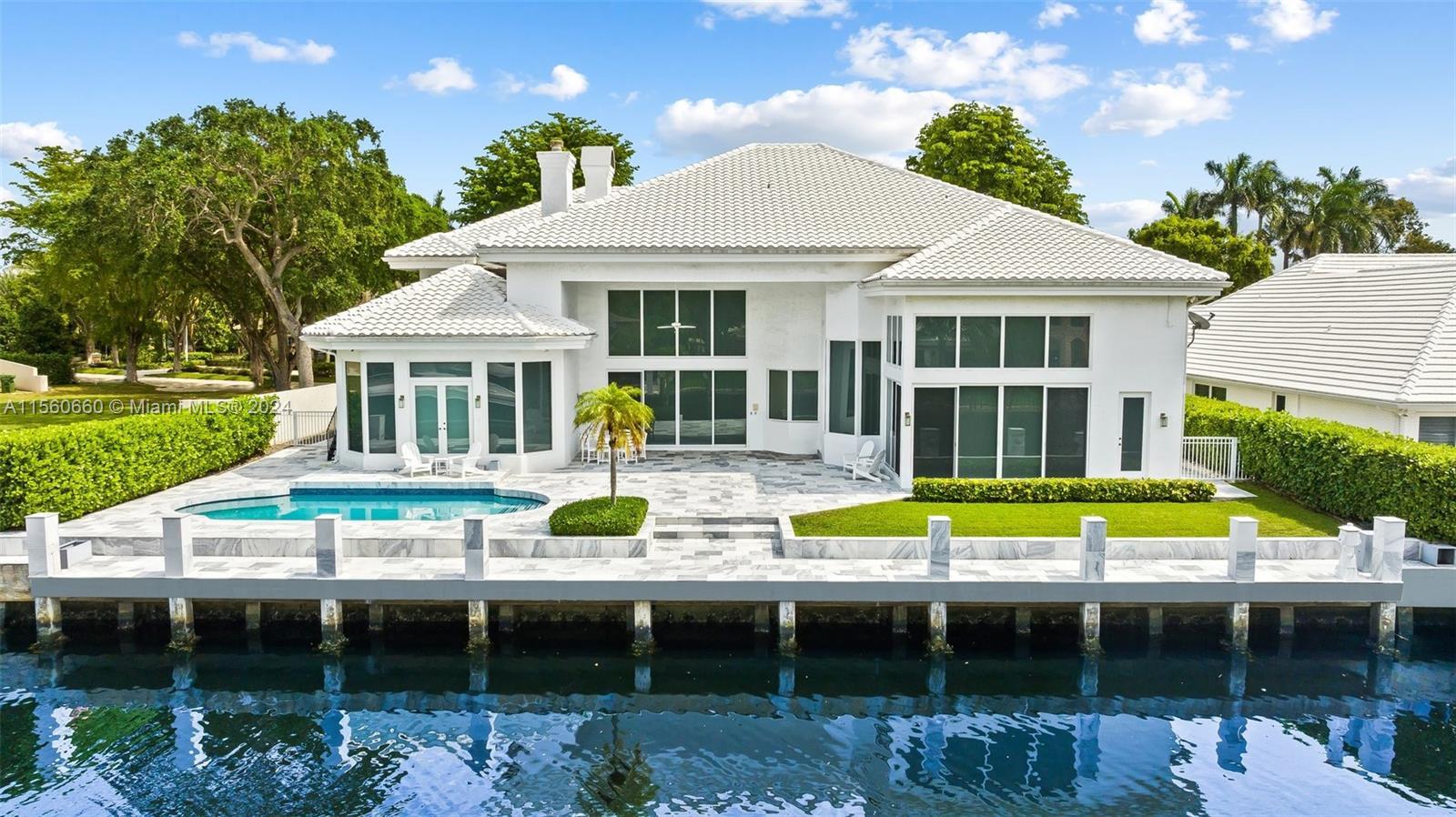 Luxury waterfront living awaits at 101 Bay Colony Dr. This expansive 7-bed, 8-bath estate spans 5,70