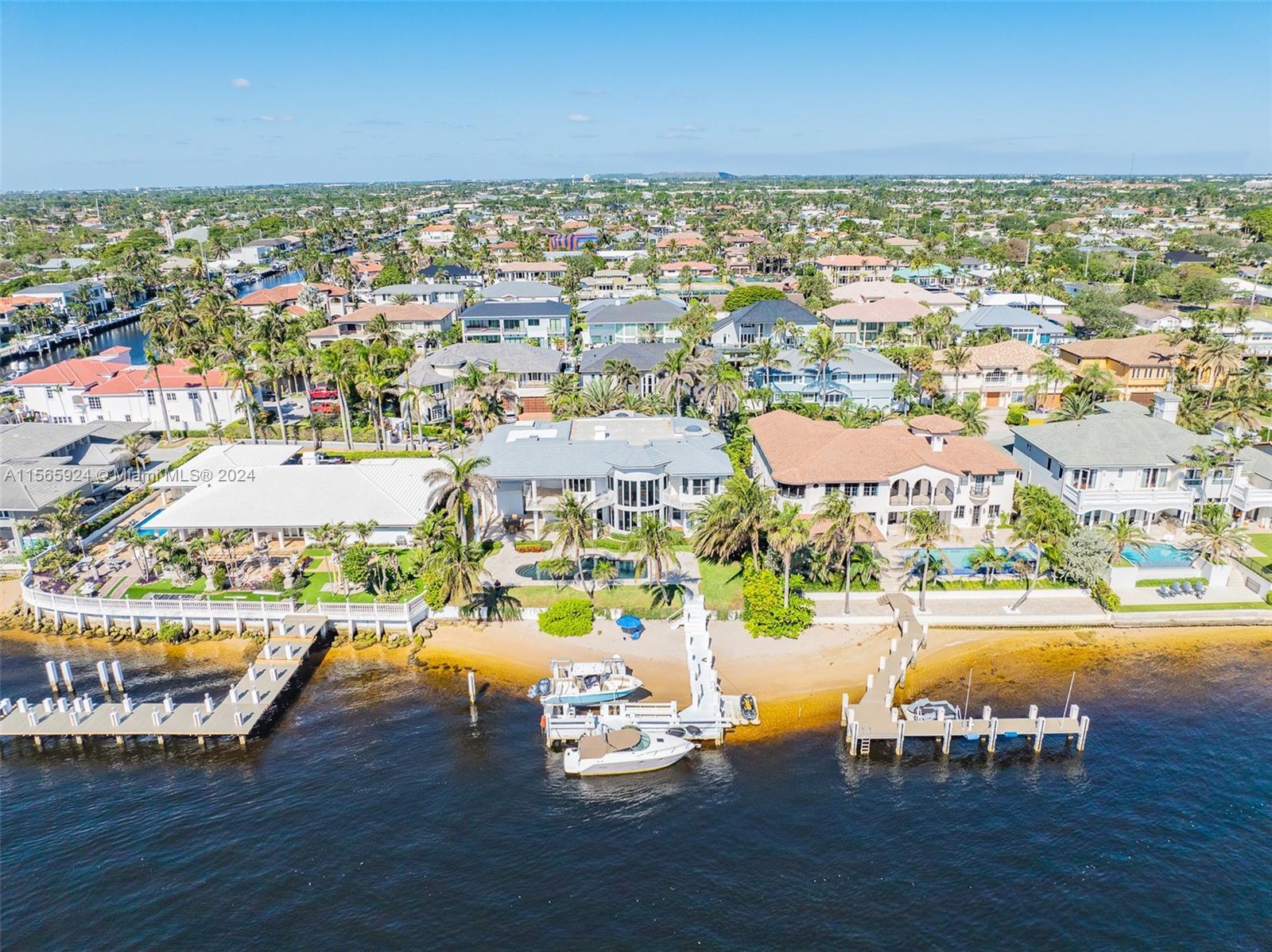 Welcome to waterfront luxury living in Lighthouse Point! This stunning estate offers an unparalleled