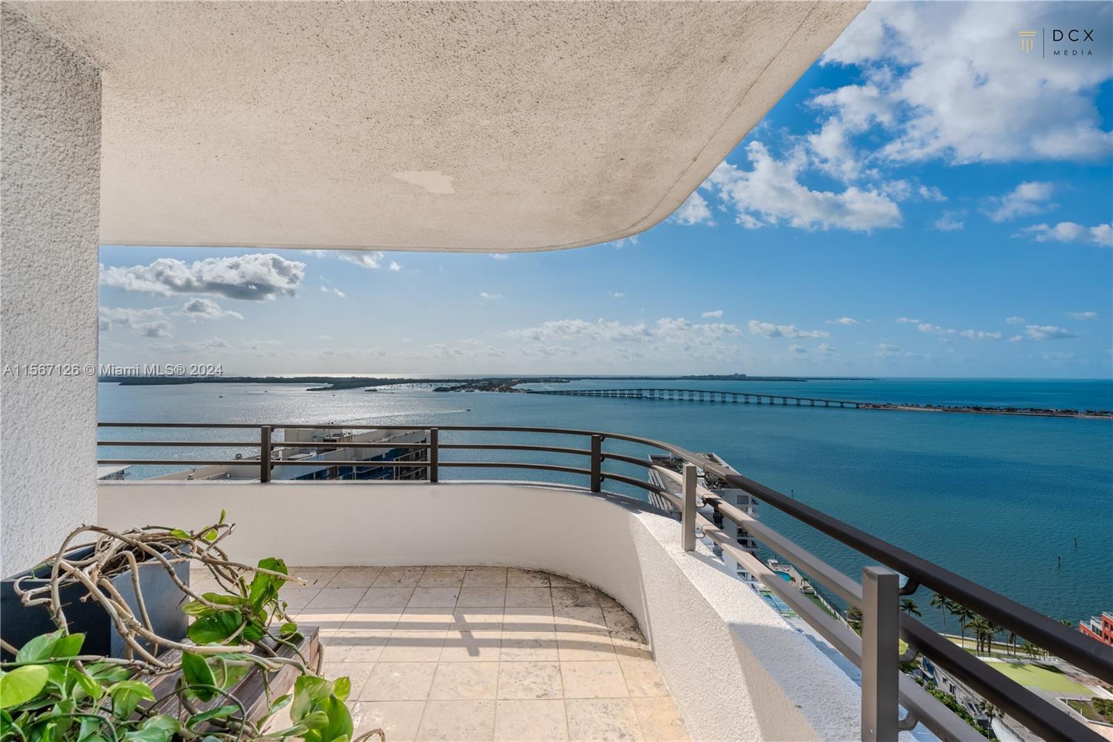 Enjoy breathtaking views of the ocean, Biscayne Bay, city and hammock from this penthouse-level, 2 b