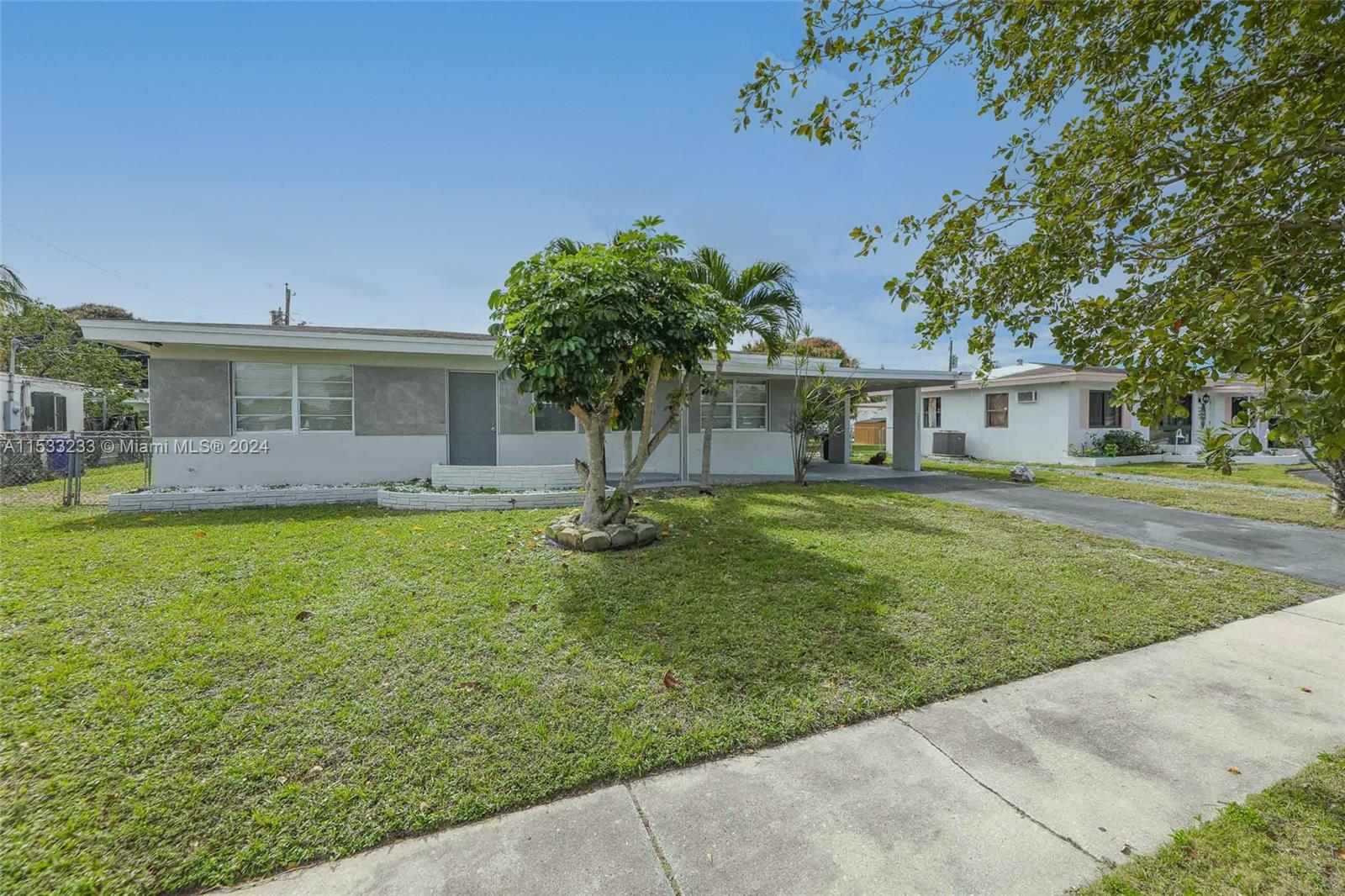 Fully renovated 4-bed 2-bath home with a car port and driveway. Home features, a new quartz kitchen 