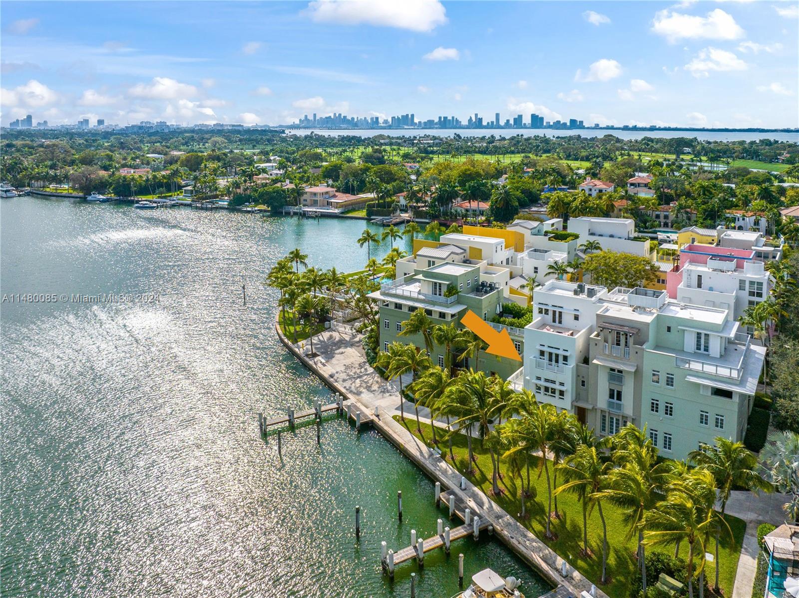 Premier Island Living on Private Aqua Island! This exceptional corner townhouse is nestled right on 