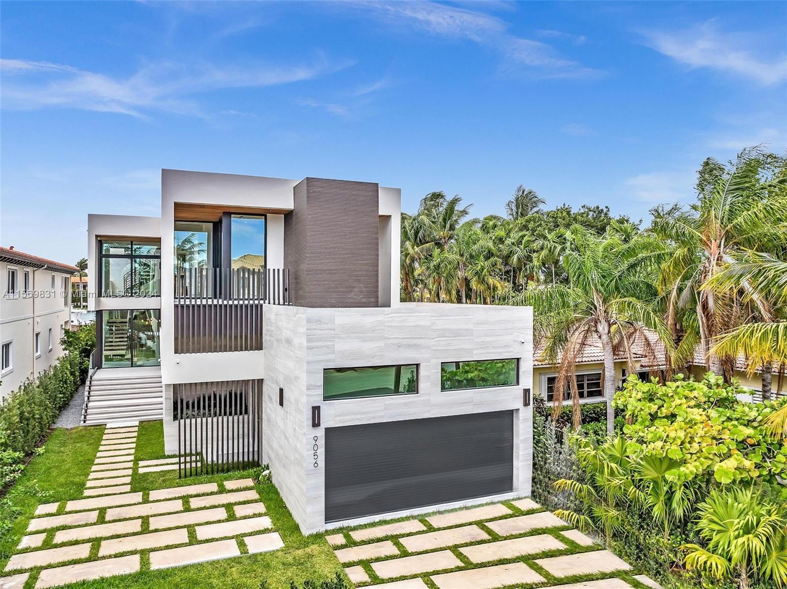This newly built mansion offers an impressive 6,565 SF of space, boasting 7 bedrooms, 7.5 bathrooms,