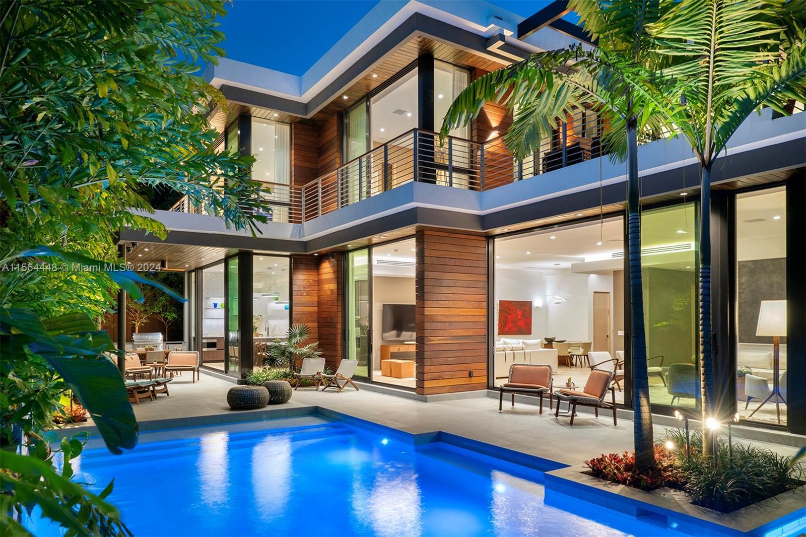 Stunning, new construction tropical modern home on a serene street in coveted North Coconut Grove, o